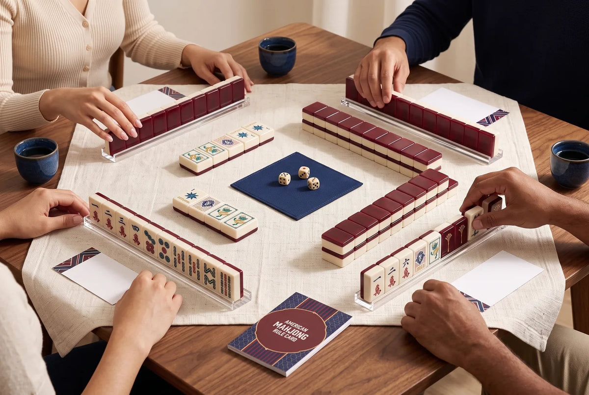 An American mahjong game seen from above, with groups of tiles face up on top of the racks