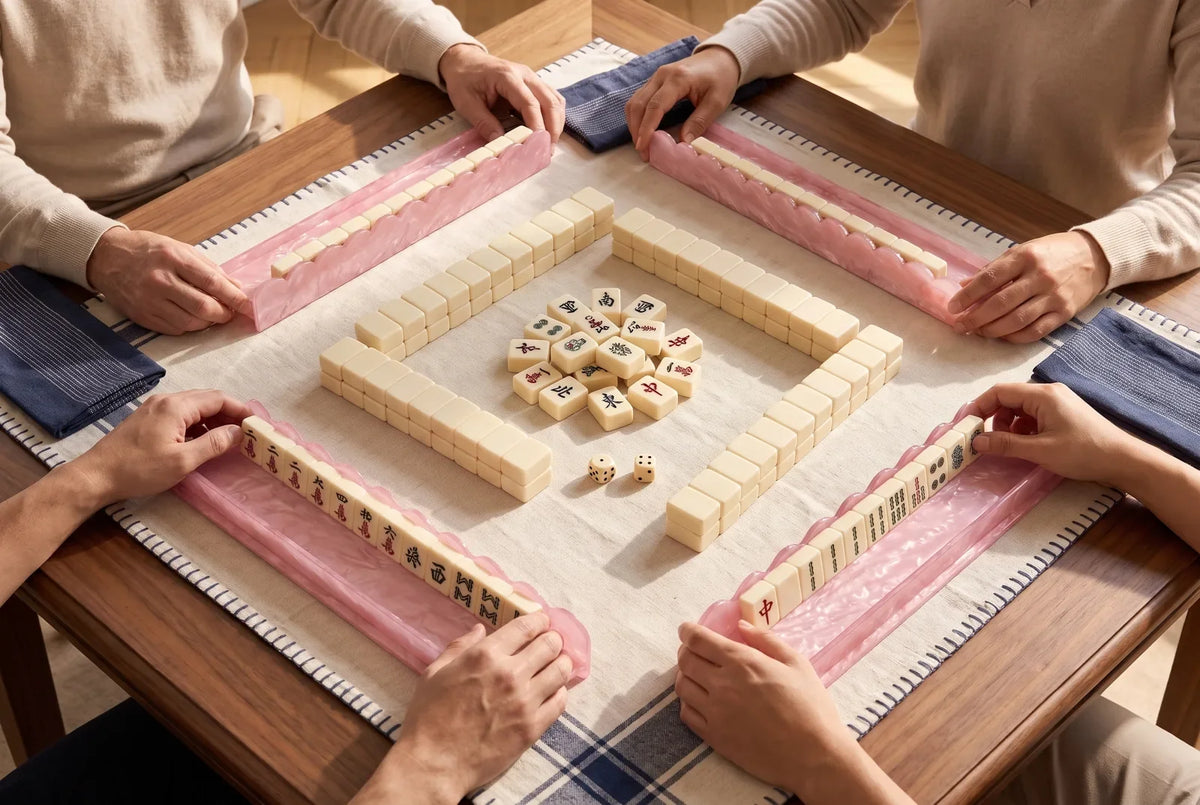 Top view of a square table set for four mahjong players, with one rack on each side