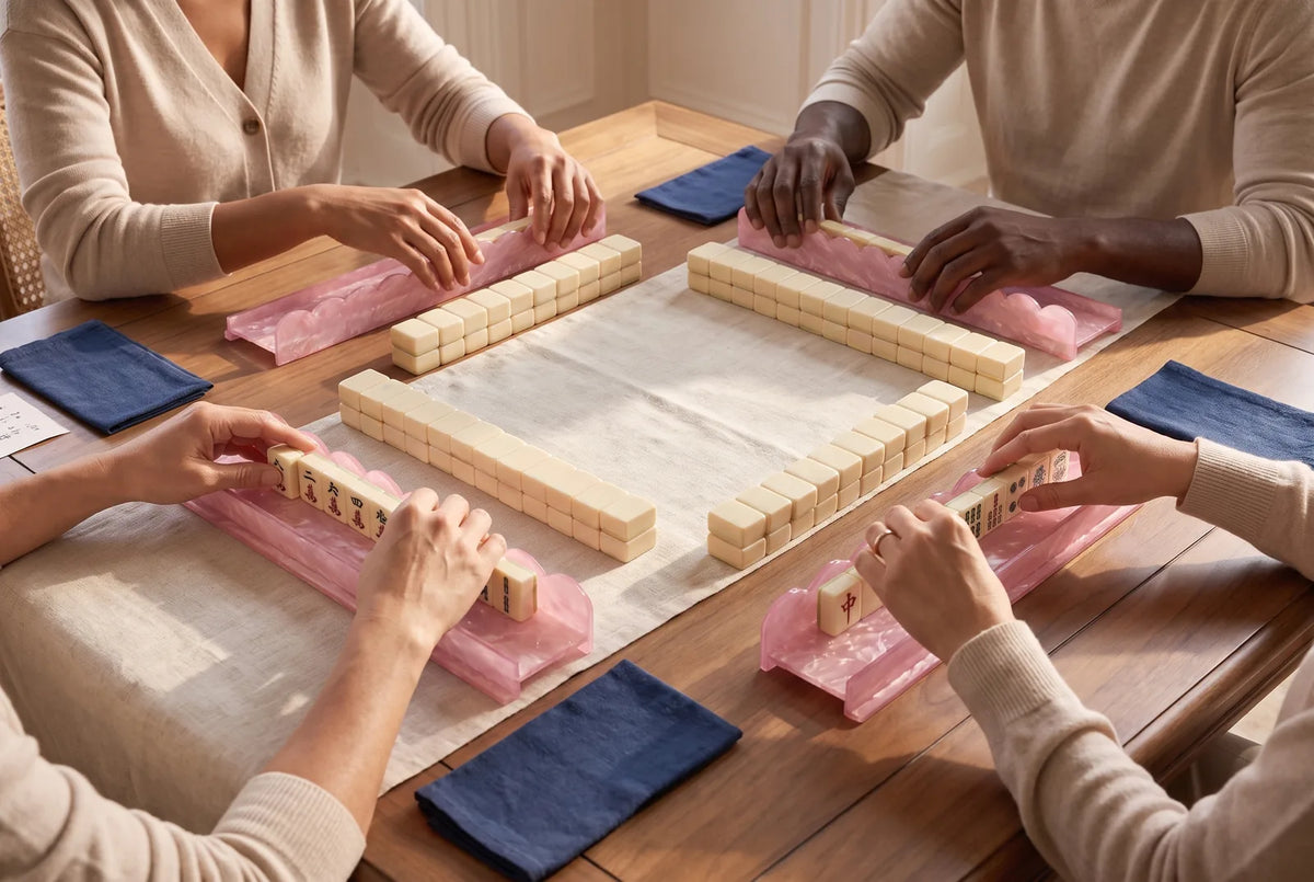 Four players build walls of tiles two high in front of their pink racks