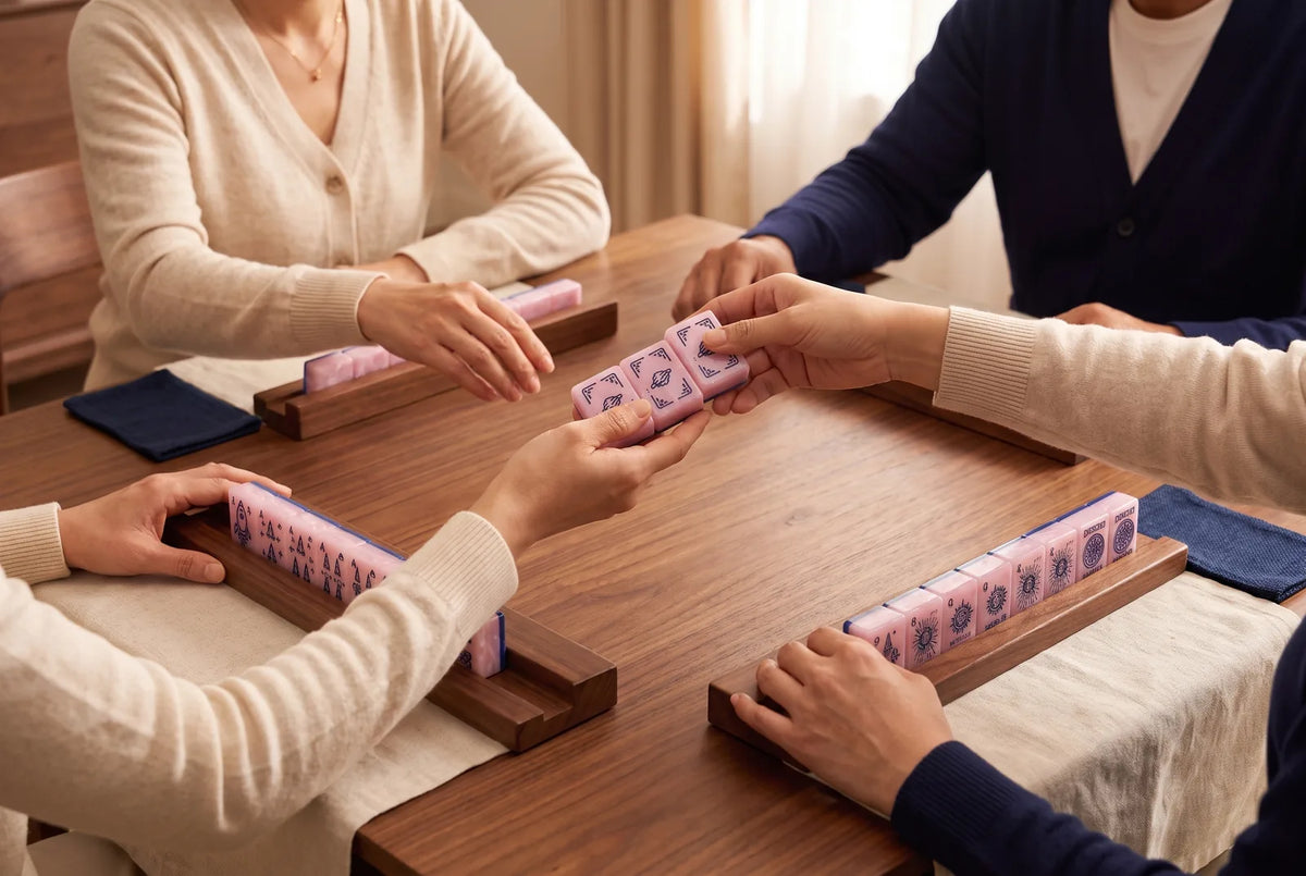 Players pass three face-down tiles across the table during the Charleston